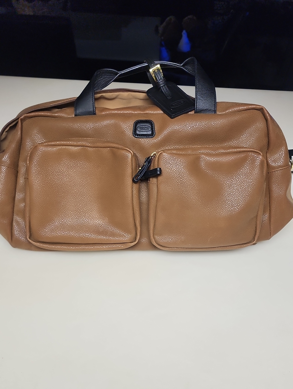 Bric's Tan Duffel with Black Handles and Gold Accent